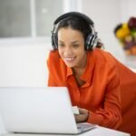 African American woman person using laptop computer to working in business at home