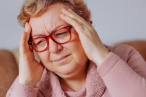 Inside the Mind of a Migraine Senior Woman Experiences Head Pain